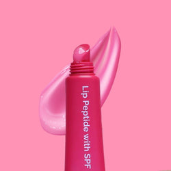 Glossy pink Lip Peptide swatch texture with SPF 15 tube by Fused Skincare